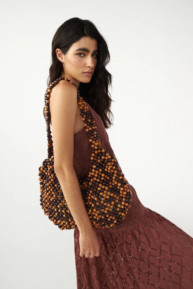 
                  
                    The Shell Handbag In Brown
                  
                